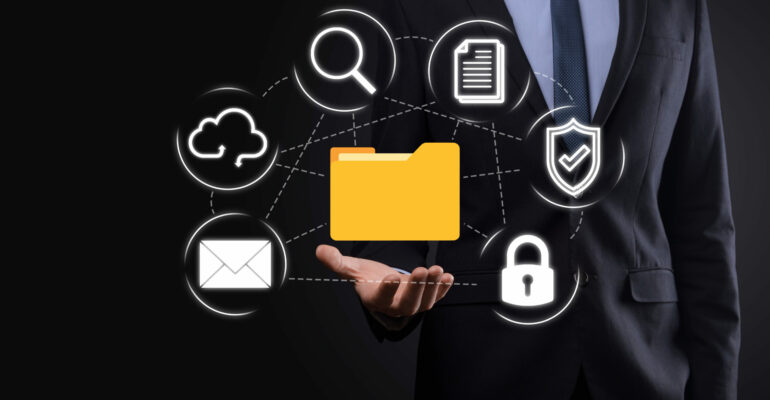 Document Management System DMS .Businessman hold folder and document icon.Software for archiving, searching and managing corporate files and information.Internet Technology Concept.Digital security